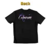 Back view of a a word "Charm" graphic t-shirt.